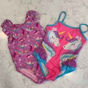 2 girls unicorn swimsuits. One Cat and Jack brand and the other Wondernation.